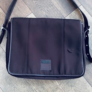 Expresso colored coach messenger bag. Leather trim.